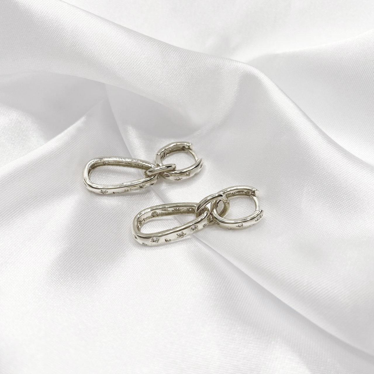 BRINCO ARTICULADO COM ELO EM ZIRCÔNIA EM RÓDIO BRANCO