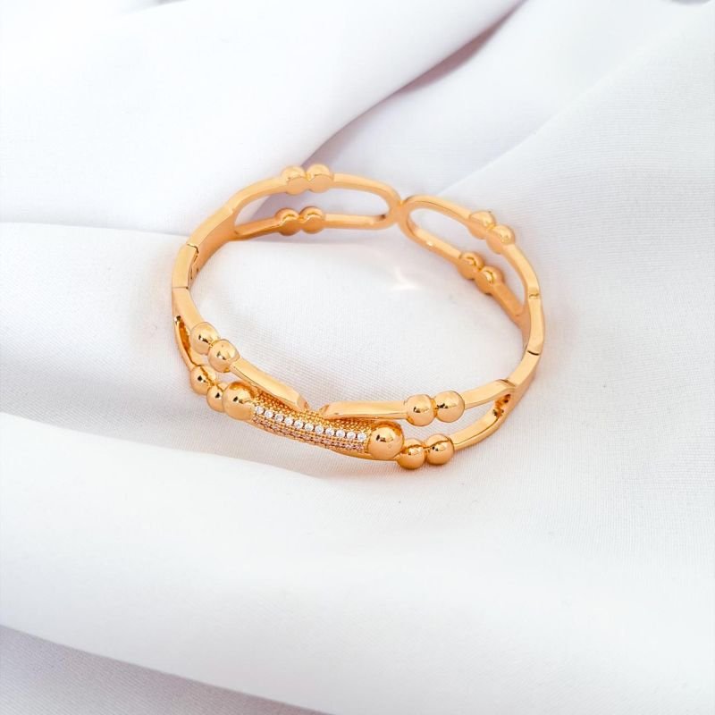 BRACELETE DETALHES EM BOLINHA E CRAVEJADO EM OURO 18K