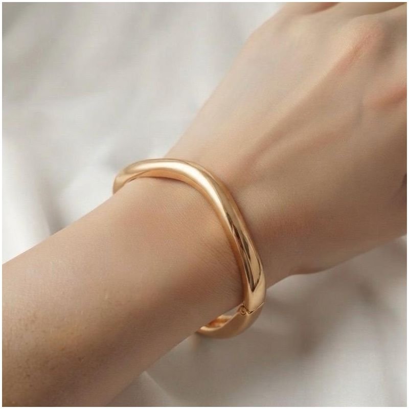 BRACELETE OVAL ONDULADO GROSSO EM OURO 18K