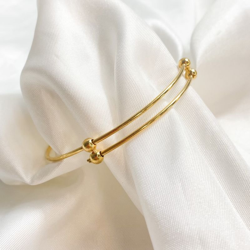 BRACELETE TRANSADO BOLINHAS EM OURO 18K