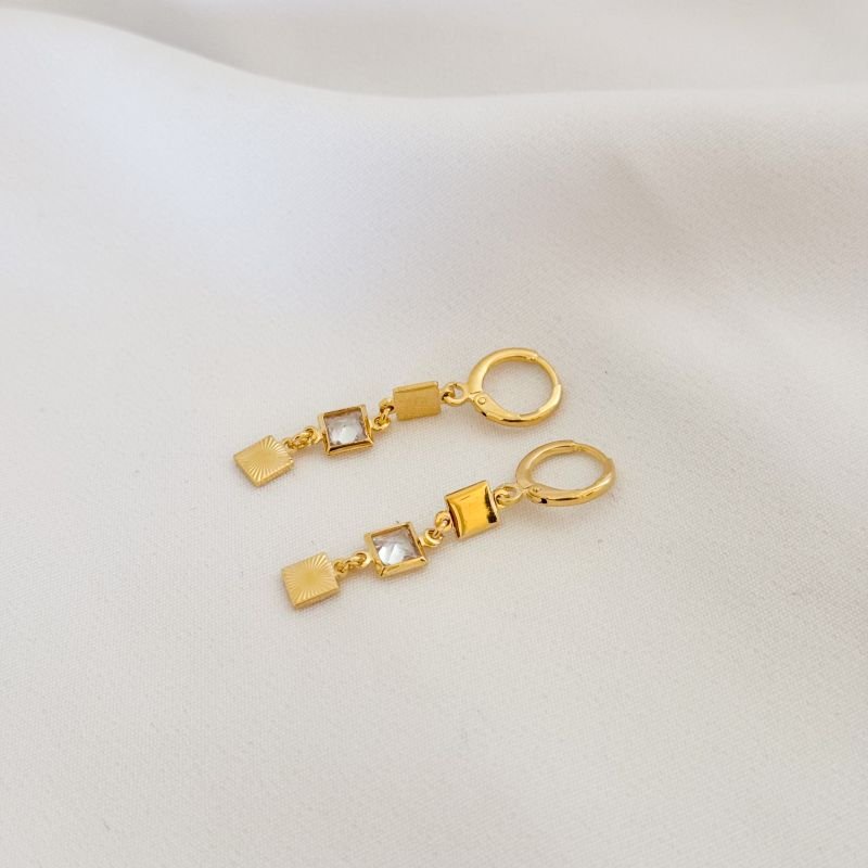 BRINCO ARTICULADO COM ZIRCONIA CARRE E QUADRADO DIAMANTADO EM OURO 18K
