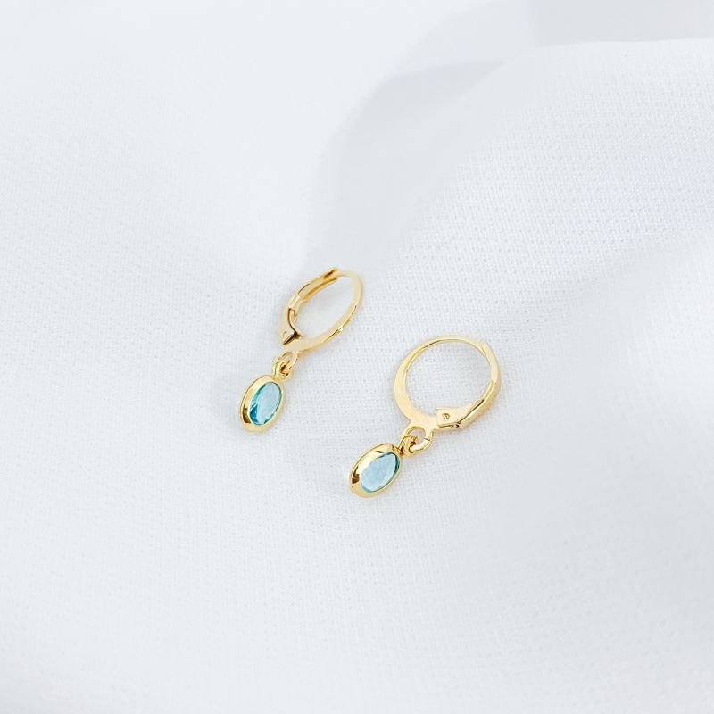 BRINCO ARTICULADO COM ZIRCONIA OVAL EM OURO 18K