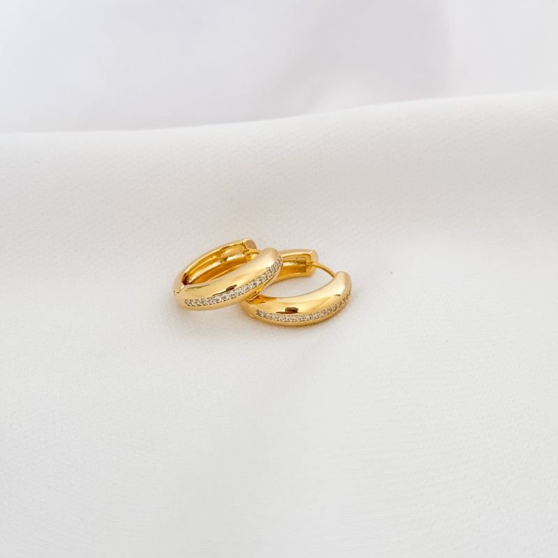 BRINCO ARTICULADO CRAVEJADO COM 1 FILEIRA DE ZIRCONIA EM OURO 18K
