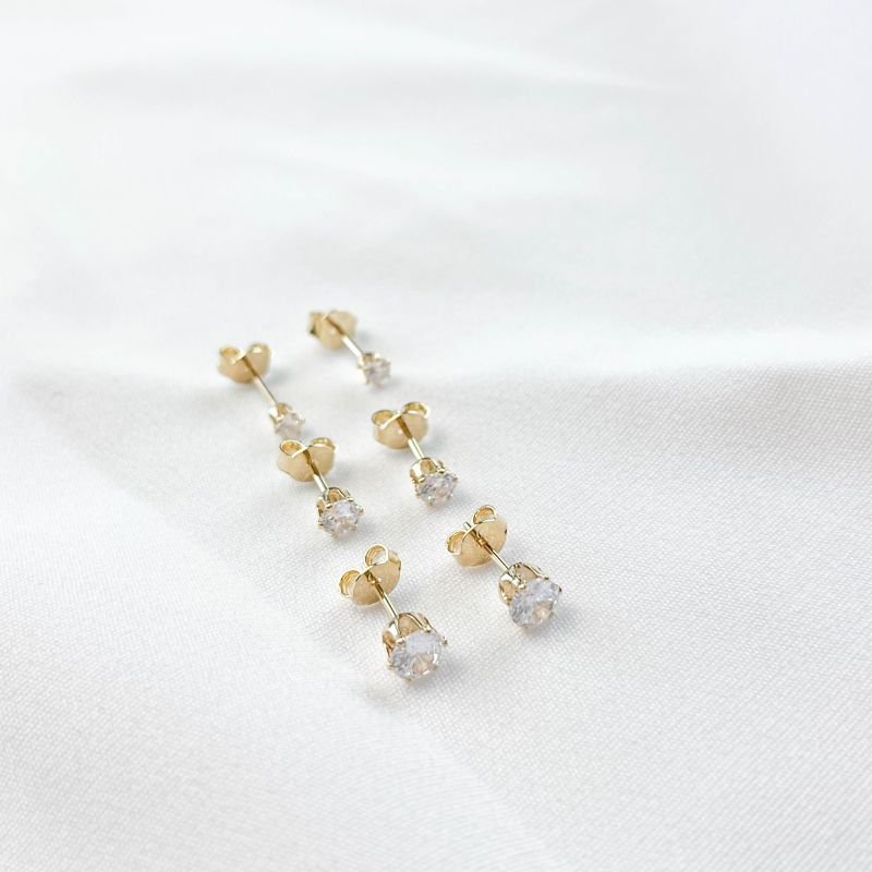 BRINCO TRIO DE PONTO DE LUZ EM OURO 18K