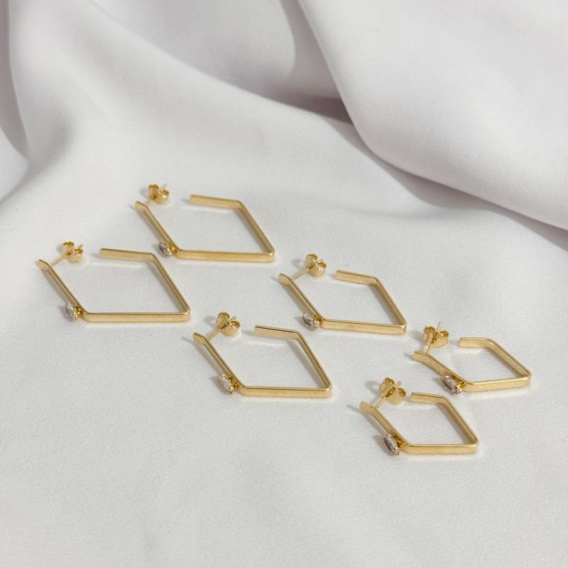 BRINCO TRIO LOSANDO COM ZIRCONIA NAVETE EM OURO 18K