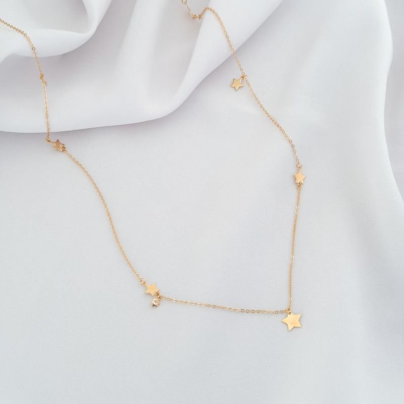 COLAR LONGO C/ ESTRELAS EM ZIR., DIAMANTADAS E LISAS 70CM EM OURO 18K