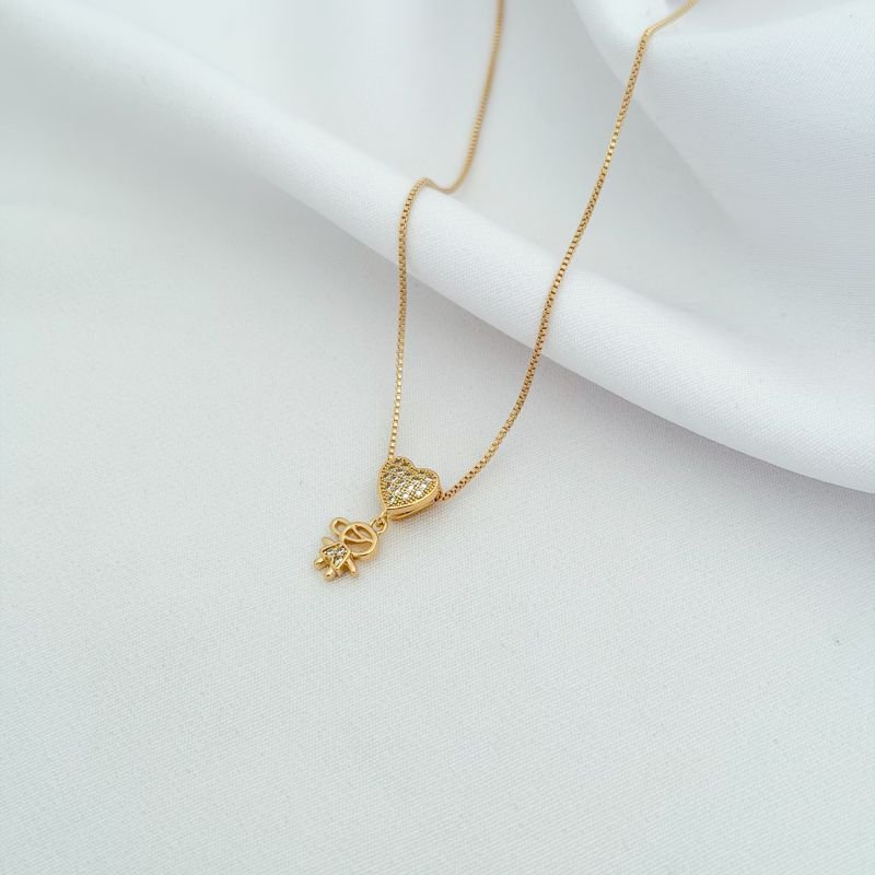 COLAR MENINO C/CORACAO PASSANTE CRAVEJADO EM OURO 18K