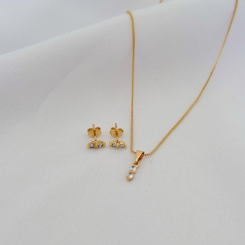 CONJUNTO DOIS PONTOS DE LUZ CRISTAL EM OURO 18K