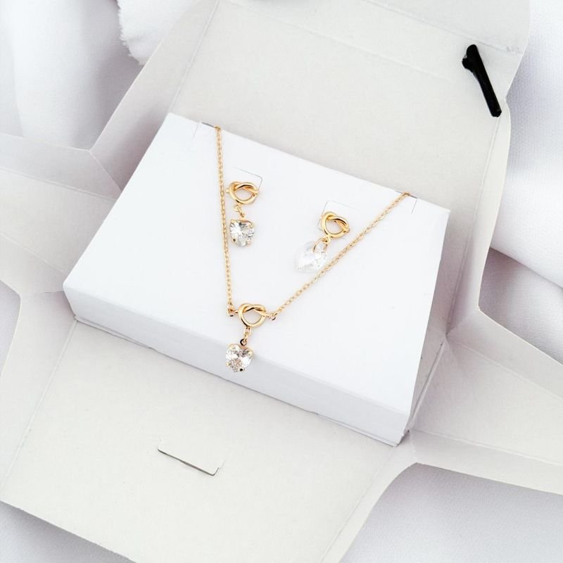 CONJUNTO NÓ COM CORAÇÃO NA CAIXINHA EM OURO 18K