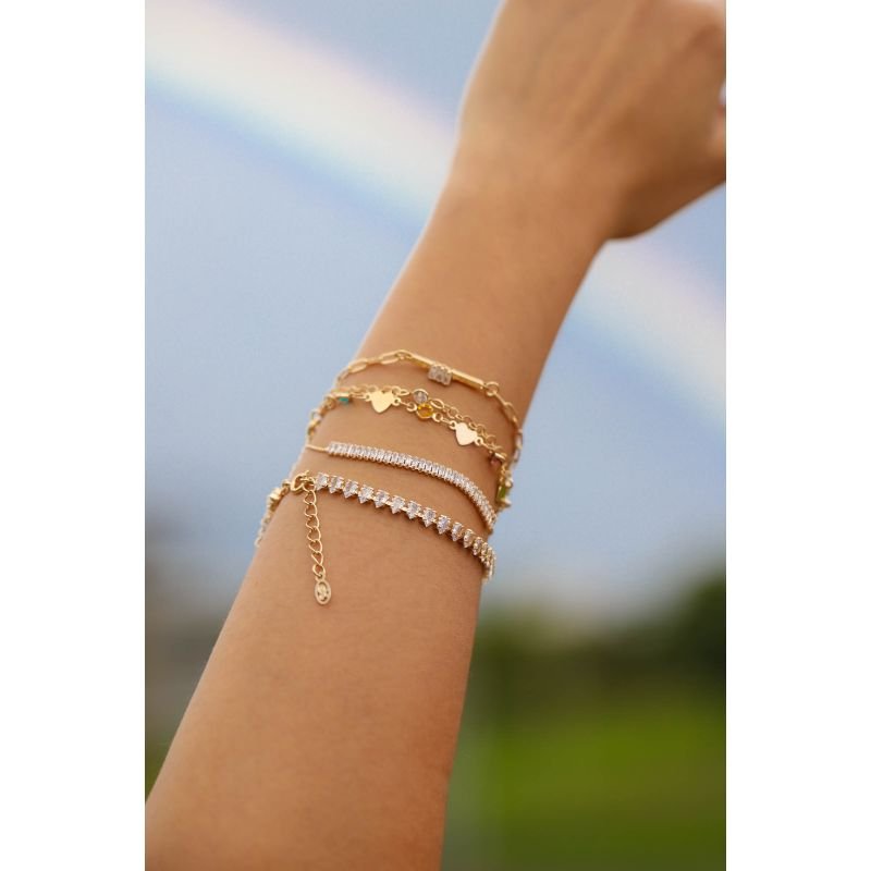 PULSEIRA CARTIER DETALHADA COM COM PINGENTE E BAGUETES EM OURO 18K