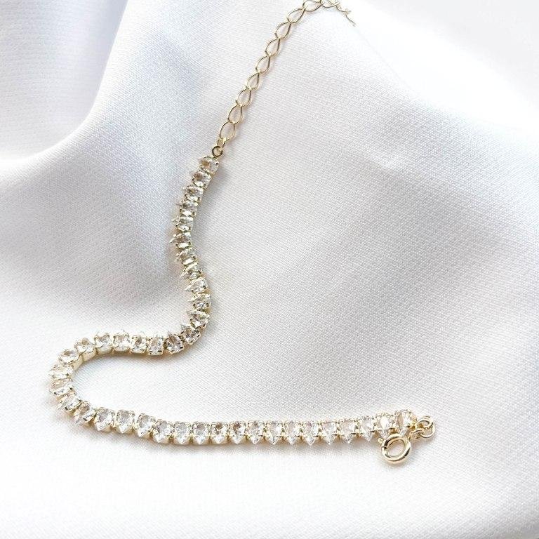 PULSEIRA RIVIERA ZIRCONIAS EM GOTA EM OURO 18K