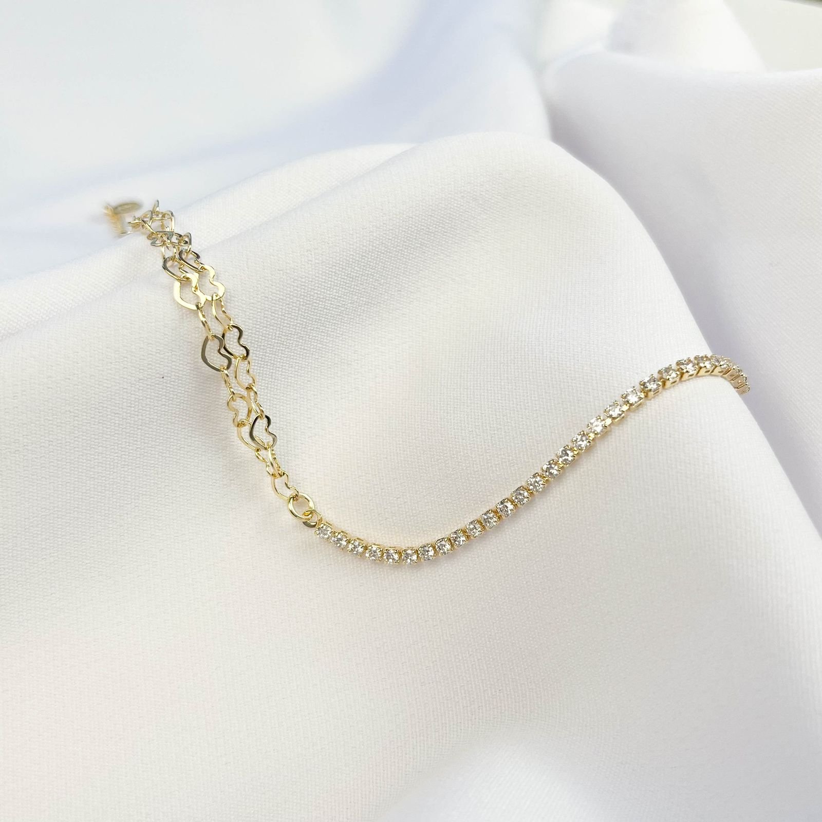 PULSEIRA ELOS DE CORAÇÃO E RIVIERA ZIRCONIAS EM OURO 18K
