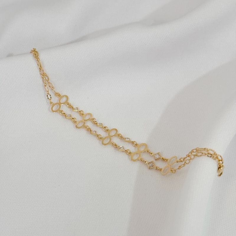 PULSEIRA COM ACESSORIO OVAL DUPLO VAZADO EM OURO 18K