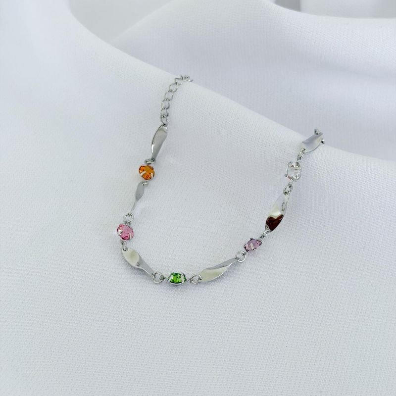 PULSEIRA COM OVAIS TORCIDA E PEDRAS COLOR 18CM + 3CM EM RÓDIO BRANCO