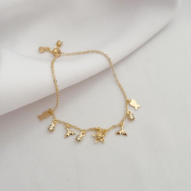 PULSEIRA FECHO DE SILICONE COM ELEMENTOS MAR EM OURO 18K