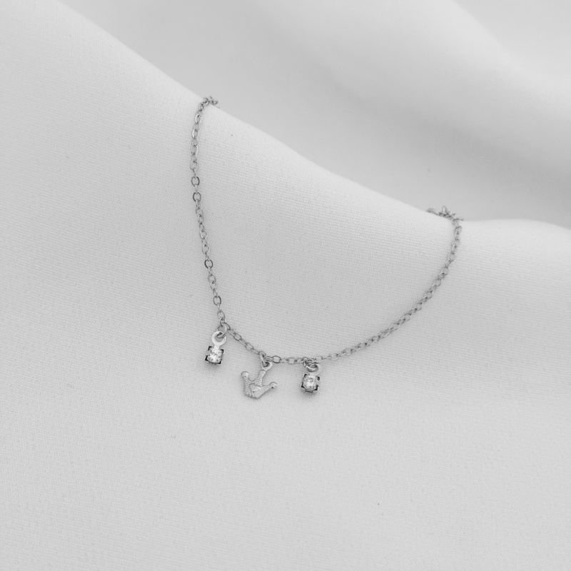 PULSEIRA INFANTIL COROINHA E PONTO DE LUZ EM RÓDIO BRANCO