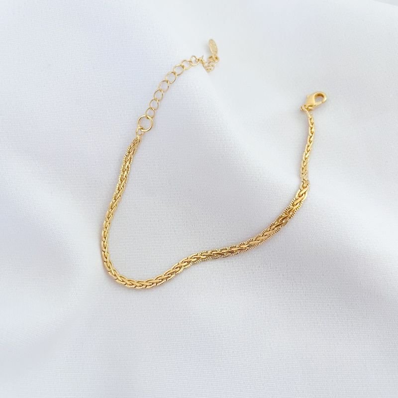 PULSEIRA MALHA TRANÇADA COM DETALHES EM OURO 18K