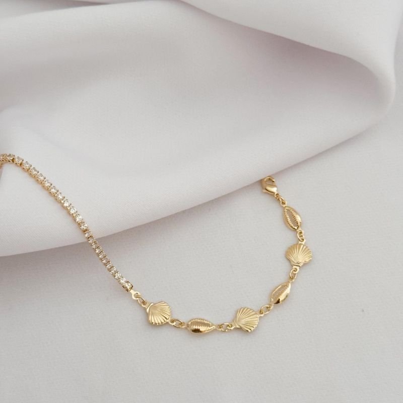 PULSEIRA RIVIERA COM CONCHAS E BUZIOS EM OURO 18K