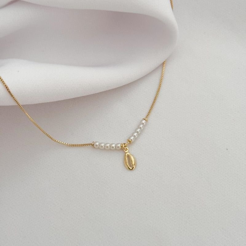 TORNOZELEIRA PEROLAS E BUZIOS EM OURO 18K