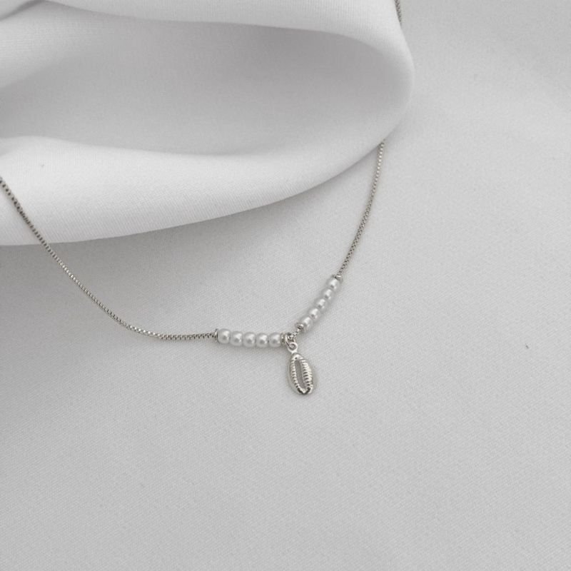 TORNOZELEIRA PEROLAS E BUZIOS EM RÓDIO BRANCO