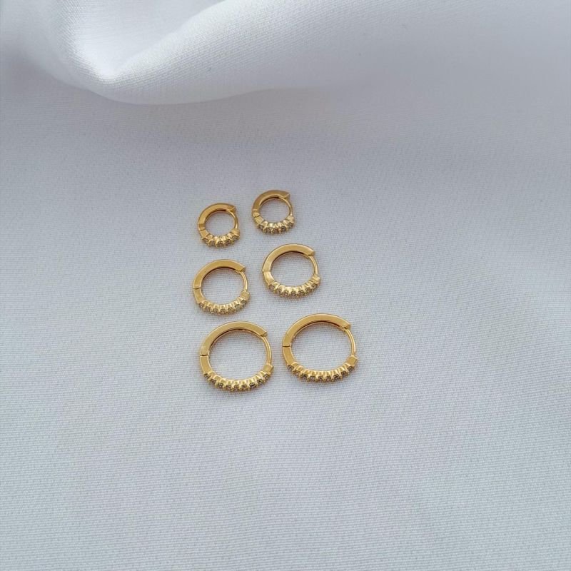 TRIO ARTICULADO 9 ZIRCONIAS EM OURO 18K